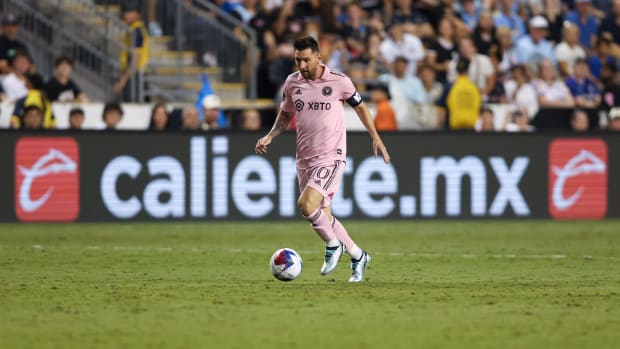 Inter Miami forward Lionel Messi kicks the ball during a game.